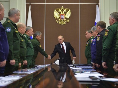 Russian President Vladimir Putin shakes hands with Defence Minister Sergei Shoigu during a meeting at the Bocharov Ruchei state residence in Sochi